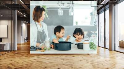 新築のリビングで母親が子供二人に料理を教えている　fmaily kids 子育て Wall mural